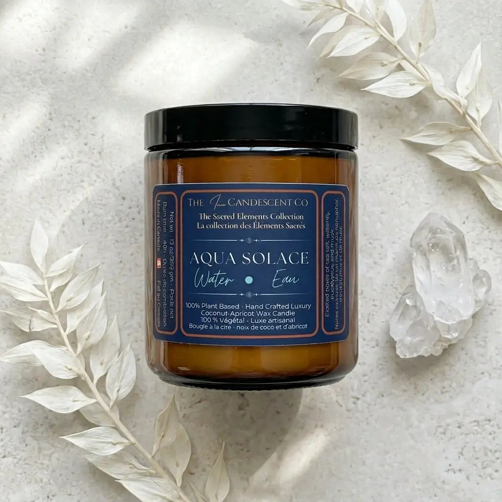 A luxury aqua water element candle by The InnerCandescent Co featuring fresh aquatic, coconut, and apricot wax for a calming ambiance.