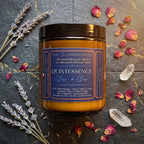 Luminous coconut and apricot wax candle from The InnerCandescent Co's QUINTESSENCE Ether Element collection, with a soft glow.