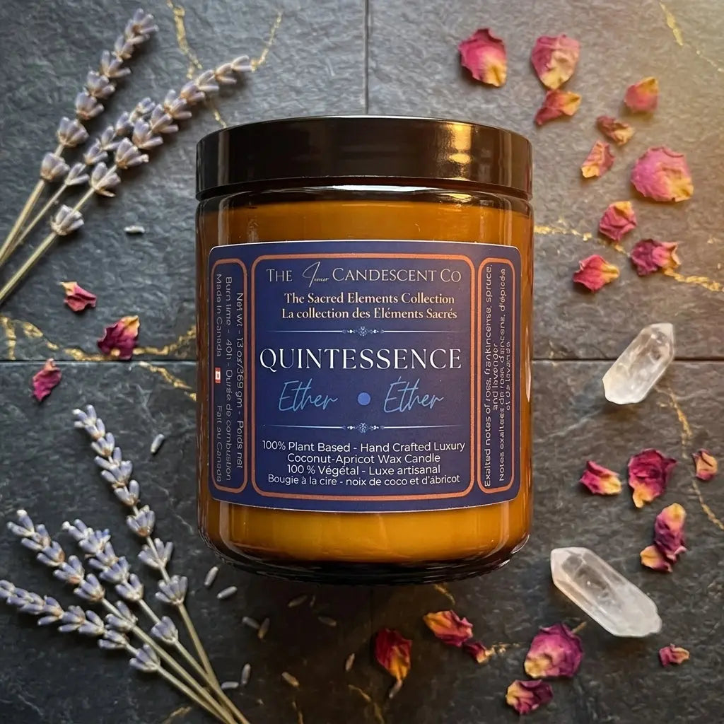 Luminous coconut and apricot wax candle from The InnerCandescent Co's QUINTESSENCE Ether Element collection, with a soft glow.