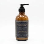 Luxurious AURORA CITRUS hand and body lotion by The InnerCandescent Co with bright citrus scent, shown in a sleek bottle.