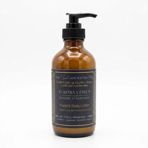 Luxurious AURORA CITRUS hand and body lotion by The InnerCandescent Co with bright citrus scent, shown in a sleek bottle.