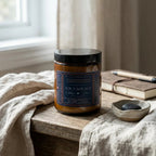 A luxurious AQUA SOLACE water element candle by The InnerCandescent Co with fresh aquatic, coconut, and apricot wax in a sleek container.