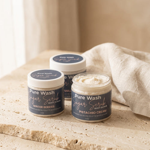 Pure Wash body sugar scrub with exfoliating granules and natural ingredients in a clear jar