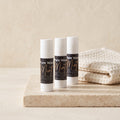 Pure Wash mint lip balm tubes showing smooth, natural lip balm with mint flavor in sleek packaging.