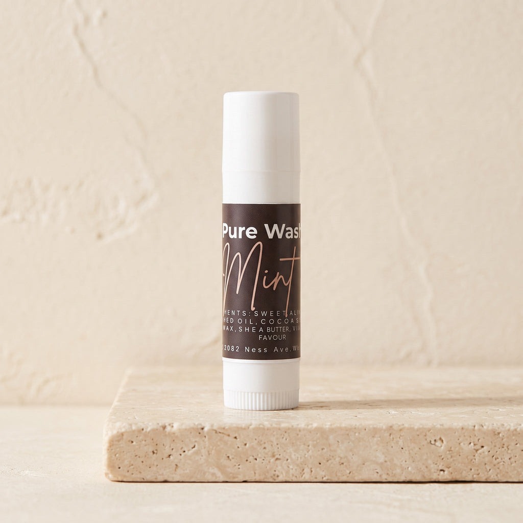 Pure Wash mint lip balm in a small container, featuring a smooth, natural finish and a refreshing mint scent.
