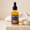 Pure Wash Sea Buckthorn Facial Oil bottle with dropper, showcasing the natural golden liquid in a clear glass container.