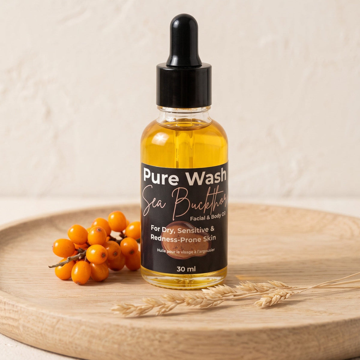 Pure Wash Sea Buckthorn Facial Oil bottle with dropper, natural skincare product for nourishing and revitalizing skin.
