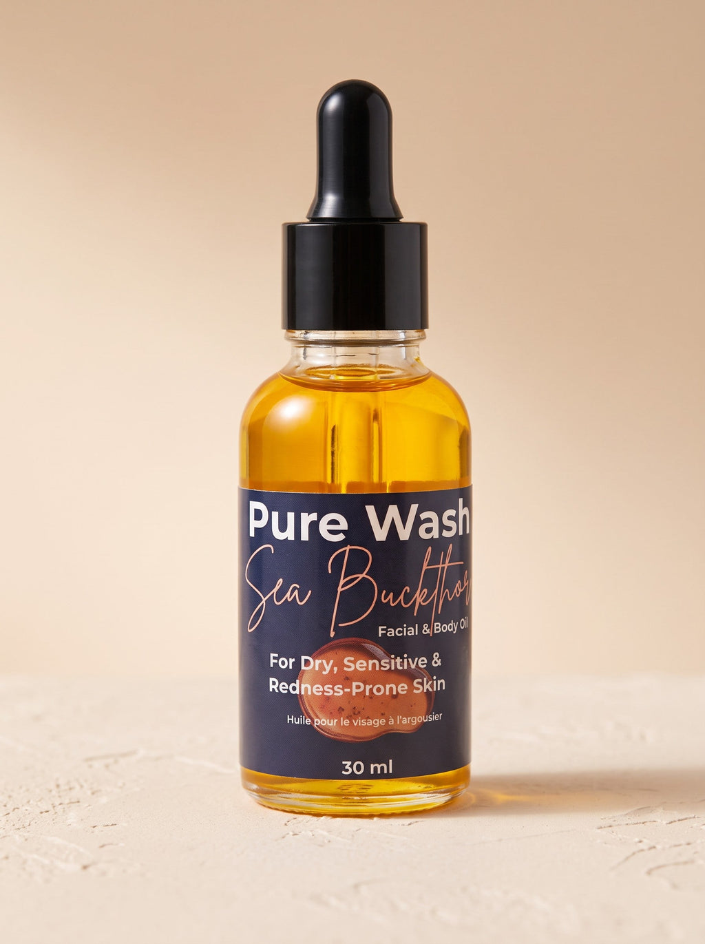 Pure Wash Sea Buckthorn Facial Oil in a glass bottle, showcasing the nourishing facial oil with sea buckthorn berries.