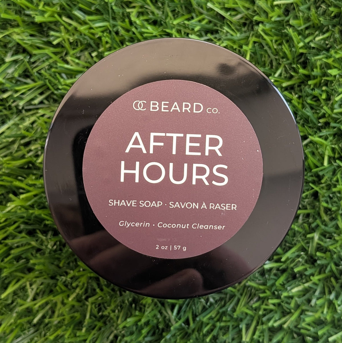 OC Beauty Co. After Hours Shave Soap in a classic round tin, showing the soap's smooth, creamy surface and minimalist label.