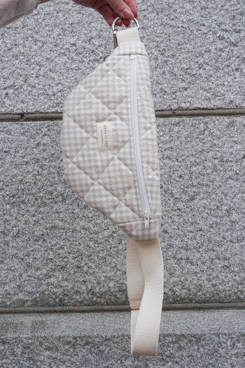 Beige quilted reusable zippered waist bag from Dans Le Sac featuring a compact design and adjustable strap.