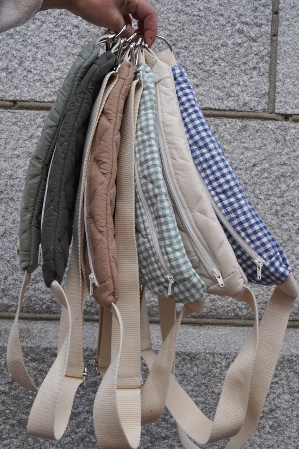 Reusable zippered pouch from Dans Le Sac in small size, made of eco-friendly materials, showing its compact design and zipper closure.