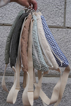 Reusable zippered pouch from Dans Le Sac in small size, made of eco-friendly materials, showing its compact design and zipper closure.