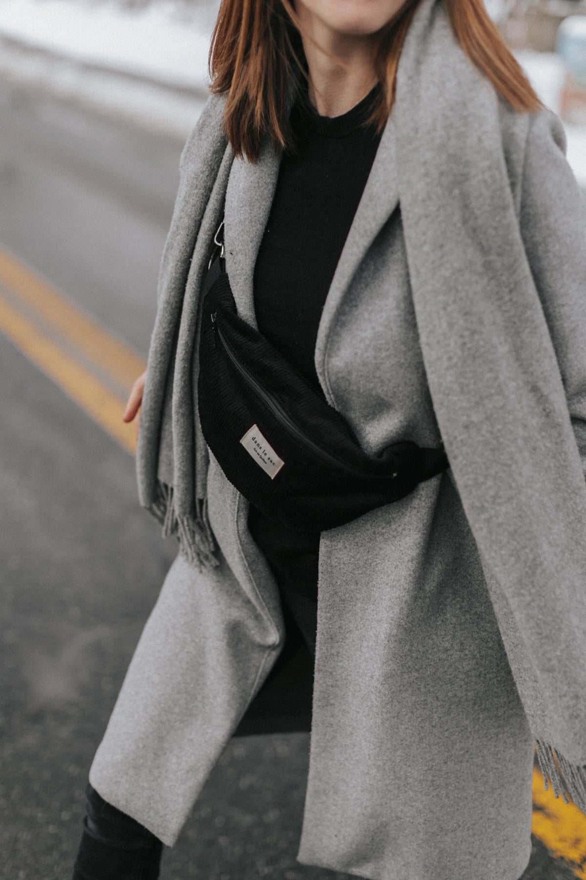 Black reusable zippered waist bag from Dans Le Sac, compact and versatile for everyday use.