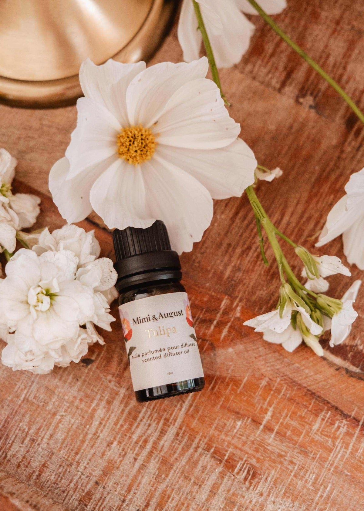 Mimi & August Tulipa scented oil bottle with floral design, showcasing elegant packaging for aromatic essential oils.